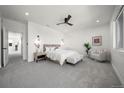 Spacious main bedroom with a ceiling fan, lots of natural light, and neutral decor at 3485 S Clermont St, Denver, CO 80222