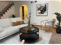 Bright living room with modern sofa and coffee table at 5547 S Lowell Blvd, Littleton, CO 80123