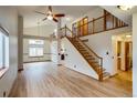 Bright and airy living room with hardwood floors and a soaring ceiling at 11213 Vilas St, Parker, CO 80134