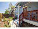 Inviting front entrance featuring a garden, wooden door, and a charming porch area at 1605 17Th St, Boulder, CO 80302