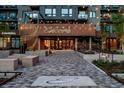 Beautiful building entrance, featuring paved walkway, landscaping, and lighting at 20 Wilcox St # 309, Castle Rock, CO 80104