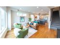 Inviting living room with wood floors, stylish furniture, and an open floor plan at 1355 Zenobia St, Denver, CO 80204
