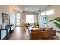 Cozy living room with wood floors, modern furniture, and ample natural light at 1355 Zenobia St, Denver, CO 80204