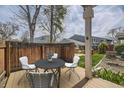 A furnished patio with a table and chairs provides an outdoor gathering space at 2557 S Dover St # 25, Lakewood, CO 80227