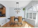 Bright dining room with modern light fixture and large window at 3425 W 111Th Loop # B, Westminster, CO 80031