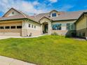 Charming home with a well-maintained lawn, tile roof, attached garage, and inviting front entrance at 3425 W 111Th Loop # B, Westminster, CO 80031