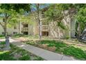 Charming apartment complex featuring outdoor balconies and manicured landscaping, creating an inviting curb appeal at 4070 S Atchison Way # 304, Aurora, CO 80014