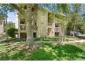 Attractive building exterior with lush lawn, mature trees, and charming balconies in a desirable community at 4070 S Atchison Way # 304, Aurora, CO 80014