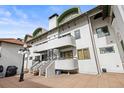 Exterior view showing the patios, balconies, and staircases of the home at 704 N Pearl St # 0-323, Denver, CO 80203