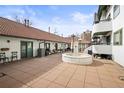 Large patio area features a fountain, seating and access to different parts of the home at 704 N Pearl St # 0-323, Denver, CO 80203