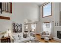 Airy living room with tall ceilings, lots of windows and a great view into the dining room at 5161 S Emporia Way, Greenwood Village, CO 80111