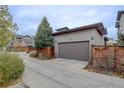 Attached garage with ample space, set back from the main road for added privacy at 10630 E 26Th Ave, Aurora, CO 80010