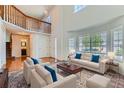 Bright living room with soaring ceilings, large windows, and elegant furnishings at 11034 W Aqueduct Ln, Littleton, CO 80127