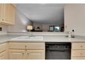 Kitchen with gray countertops, double sink, and dishwasher at 1695 Carr St # B, Lakewood, CO 80214