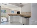 Modern kitchen boasts stainless steel appliances, a convenient double sink, and ample countertop space at 18954 E 57Th Pl # D, Denver, CO 80249