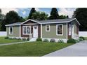 Attractive single-story home with a warm earth-toned exterior, white trim, well-kept lawn, and welcoming entryway at 154 Grove St, Denver, CO 80219