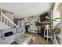 Spacious living room with a large sectional, modern shelving, and an inviting atmosphere for relaxation at 5415 S Delaware St, Littleton, CO 80120