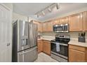 Well-equipped kitchen with stainless steel appliances and ample cabinetry for storage and food prep at 479 Black Feather Loop # 311, Castle Rock, CO 80104