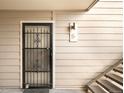 Secured entrance with decorative metal door and unit number, offering both security and style at 4896 S Dudley St # 6-5, Littleton, CO 80123