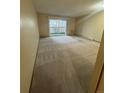 This spacious living room offers a blank canvas and sliding door to patio at 750 S Alton Way # 8C, Denver, CO 80247