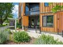 Stylish condo entrance with wood paneling and a welcoming front porch at 1601 Park Ave # 106, Denver, CO 80218