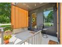 Close-up of inviting condo entrance with a covered porch and sleek design at 1601 Park Ave # 106, Denver, CO 80218