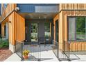 Close-up of condo entrance with a charming front porch and modern design at 1601 Park Ave # 106, Denver, CO 80218