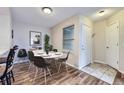Cozy dining area featuring modern furnishings, a round table, and stylish decor with great natural light at 1830 Newland Ct # 209, Lakewood, CO 80214