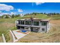 Contemporary home with a balcony and plunge pool, offering a private outdoor retreat with scenic views at 545 Strada Rossa Rd, Golden, CO 80401