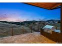 Outdoor grill and patio area showcase mountain views with a built-in stainless steel grill at 545 Strada Rossa Rd, Golden, CO 80401