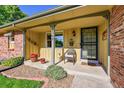 Cozy porch with decorative touches and a charming entrance at 12348 Elizabeth Ct, Thornton, CO 80241