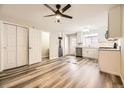 Modern kitchen with white cabinets and stainless steel appliances at 1233 S Flower Cir # D, Lakewood, CO 80232