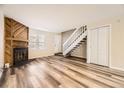 Living room with fireplace and wood flooring at 1233 S Flower Cir # D, Lakewood, CO 80232