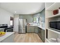 Charming kitchen with stainless steel appliances and modern countertops, ready for cooking and entertaining at 2042 Jamaica St, Aurora, CO 80010