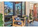 Inviting front porch featuring comfortable seating, stylish decor, and a view of the neighborhood at 1100 S Gilpin St, Denver, CO 80210
