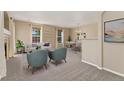 Open-concept living and dining area filled with natural light, featuring comfortable seating and stylish decor at 12784 Jasmine St # E, Thornton, CO 80602