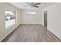 Spacious living area with hardwood floors and big window at 288 Emery, Northglenn, CO 80233