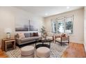 Bright living room with large window, neutral decor, and stylish furnishings, creating a comfortable and inviting space at 1907 S Columbine St, Denver, CO 80210