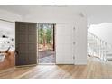 Bright foyer featuring wood floors, high ceilings, and a view of the outdoor landscape at 133 Mine Ln, Boulder, CO 80302