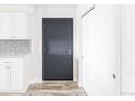 Hallway including front door and coat closet with white trim at 7877 E Mississippi Ave # 901, Denver, CO 80247