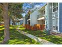 Exterior view of the community, featuring well-maintained landscaping and private balconies at 7275 S Gaylord St # I09, Littleton, CO 80122