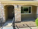 Attractive townhome facade with stone accents, manicured front yard, and welcoming entrance at 11207 Osage Cir # B, Northglenn, CO 80234