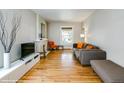 Inviting living room with hardwood floors, neutral walls, fireplace and comfortable seating perfect for relaxing at 284 S Lafayette St, Denver, CO 80209
