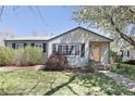 Inviting single-story home with a well-maintained lawn and attractive landscaping at 1842 S Fairfax St, Denver, CO 80222