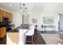 Modern kitchen featuring granite countertops, stainless steel appliances, and island with seating at 1650 Fillmore St # 504, Denver, CO 80206