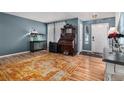 Living room with hardwood floors and a large rug at 7190 Pine Hills Way, Littleton, CO 80125