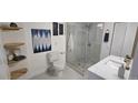 Modern renovated bathroom with a glass-enclosed shower and floating shelves at 409 N Finch Ave, Lafayette, CO 80026