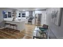 Modern kitchen with stainless steel appliances and counter seating at 409 N Finch Ave, Lafayette, CO 80026