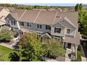 Inviting townhome featuring a well-manicured lawn and classic architectural details at 1522 Chimney Peak Dr, Castle Rock, CO 80109