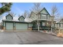 Charming two-story home featuring a three-car garage, covered porch, and lovely curb appeal at 925 Antelope W Dr, Bennett, CO 80102